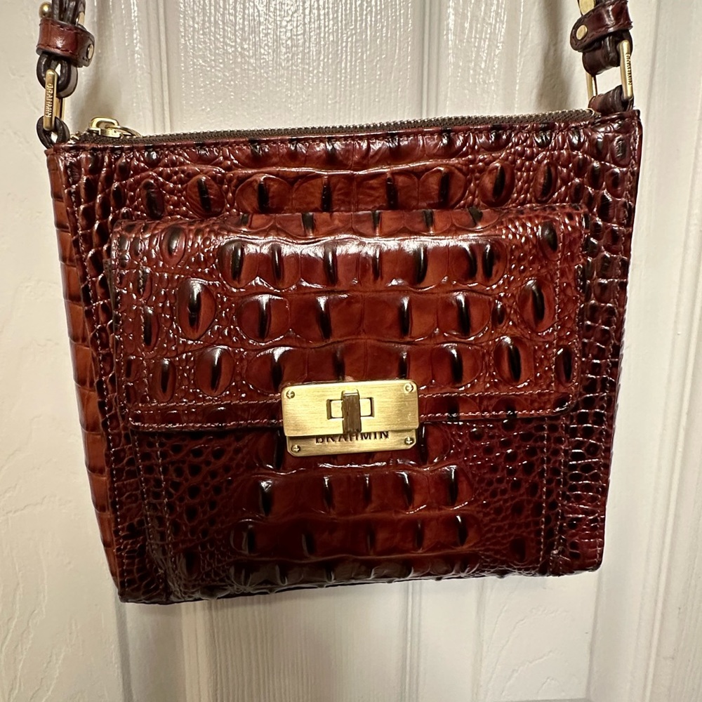 Lovely Brahmin crossbody.  no stains or tears. small scratch on clasp.